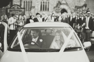 bride and groom in the car Alternative Wedding Photographer