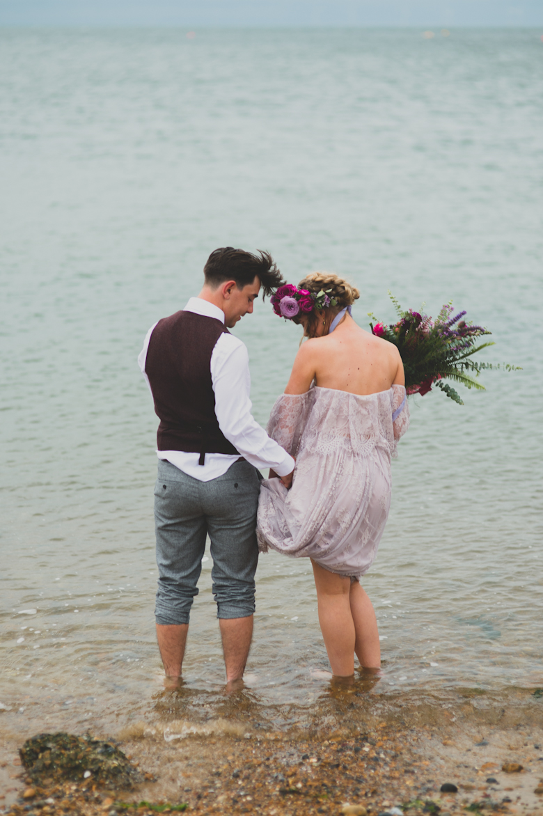 bride and groom in the sea