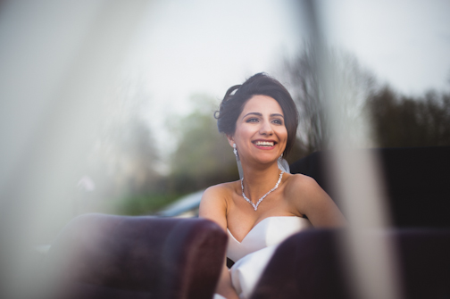 bride in the car - Alternative Wedding Photographer