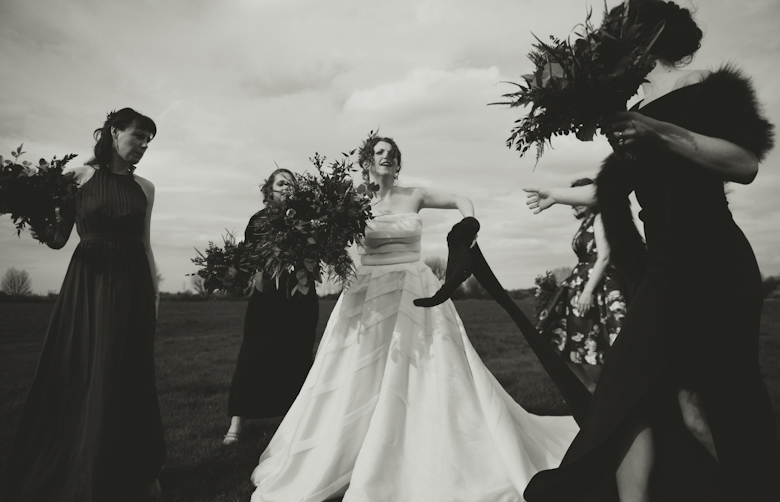 bride and bridesmaids laughing