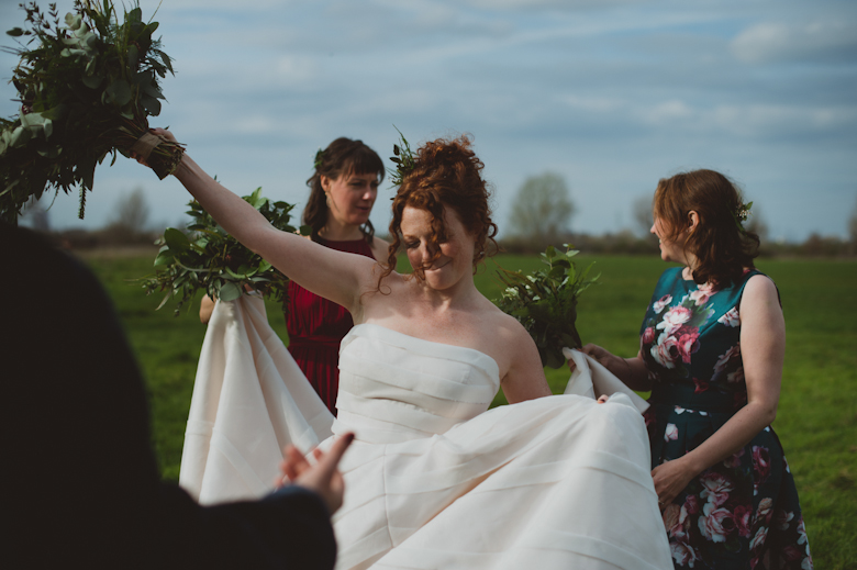 bride and bridesmaids laughing