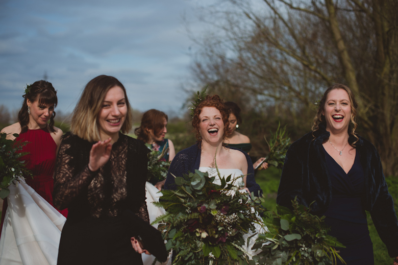 bride and bridesmaids laughing