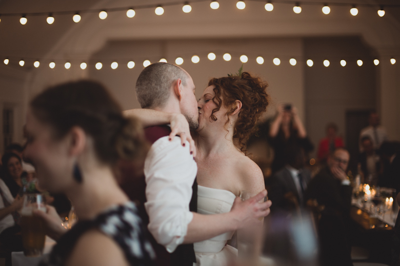 bride and groom kiss on the dance floor