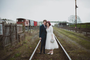 bride and groom on the train tracks, Buckinghamshire Railway Centre Wedding