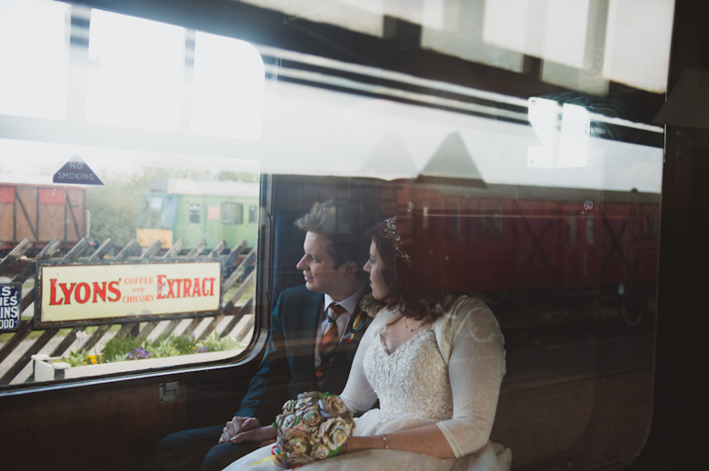 Railway wedding photography - bride and groom on the train