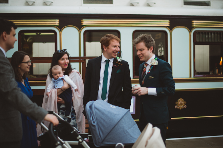 groom and friends laughing