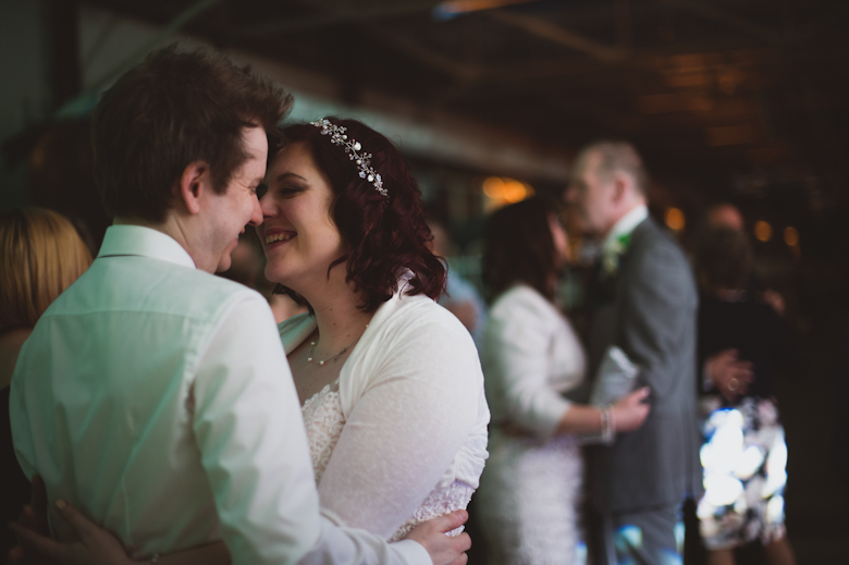 bride and groom dancing and kissing