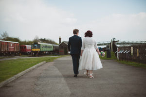 bride and groom walking away, Buckinghamshire Railway Centre Wedding