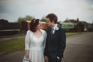 bride and groom with trains - Buckinghamshire Railway Centre Wedding