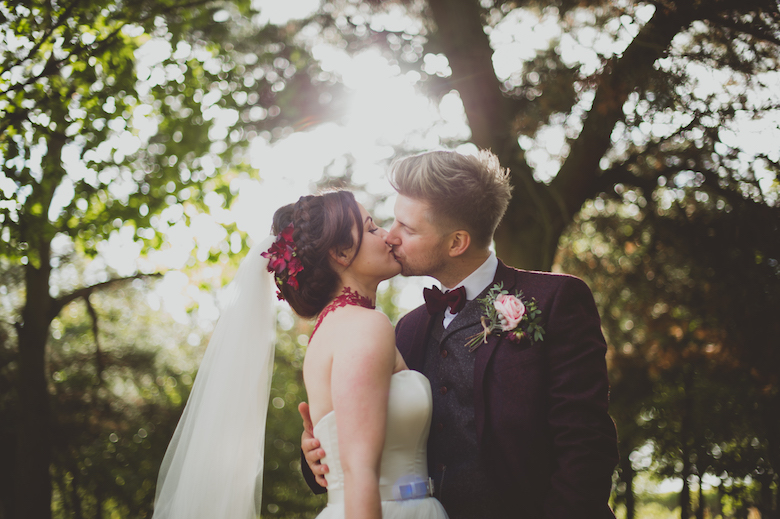 bride and groom kiss alternative wedding photographer