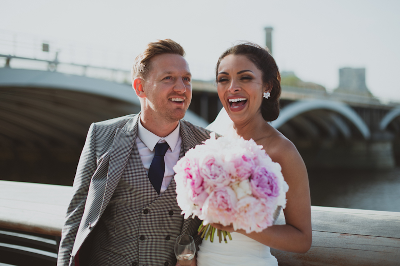 Bride and Groom laughing candid shot - London Wedding - alternative wedding - candid wedding photography - bride and groom laughing Asylum Peckham wedding