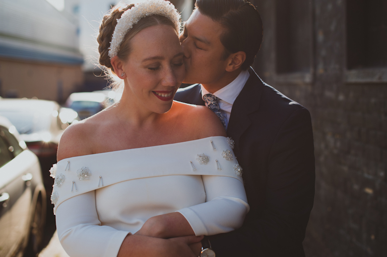 Bride and groom kiss outside the Bistrotheque, East London Wedding