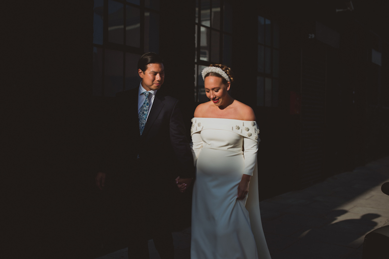 Groom and bride romantic walk at the Bistrotheque, East London Wedding