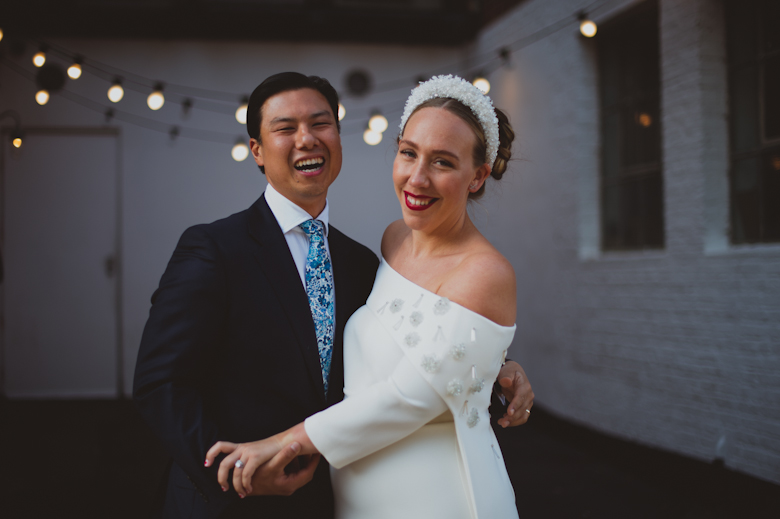 Groom and bride laughing at the Bistrotheque, East London Wedding