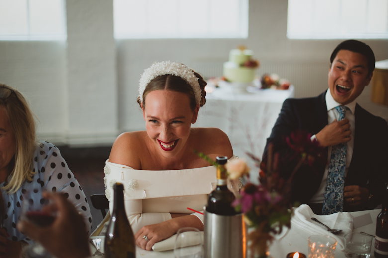 Bride laughing at the speeches at the Bistrotheque, East London Wedding