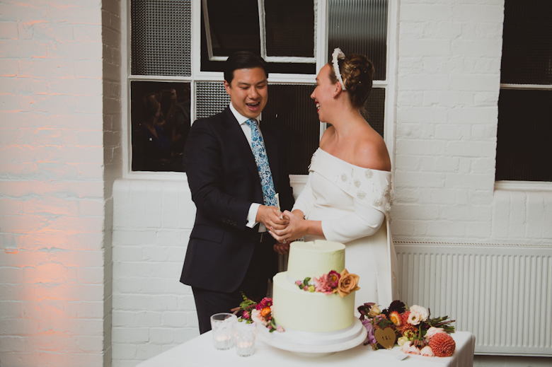 Cutting cake at the wedding reception in East London - Bistrotheque