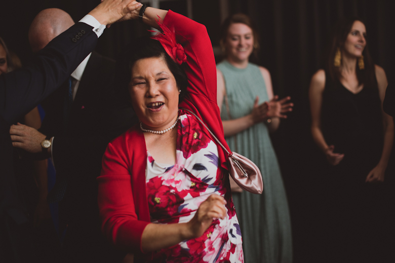 Groom dancing with his mum at the wedding reception East London