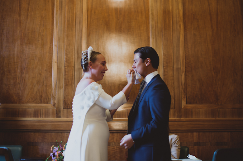 London Wedding - Hackney Town Hall Wedding Ceremony, bride wiping groom's lips