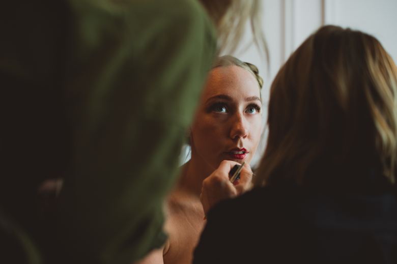 bride having make up done