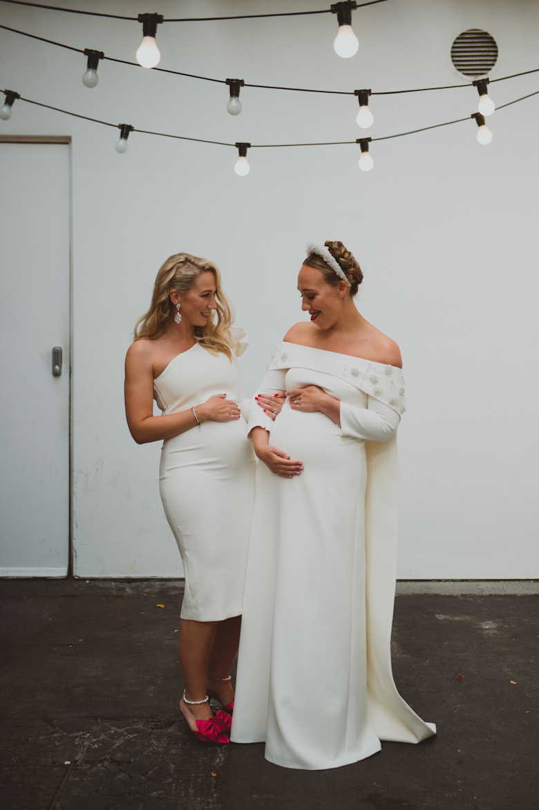 Bride and sister both with baby bumps, Bistrotheque wedding photography, East London Wedding