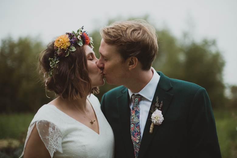 bride and groom kissing, at the Isis Farmhouse in Oxford, Oxfordshire