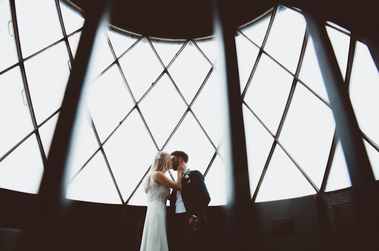 Bride and groom kiss in the lighthouse - Bride getting ready - London Wedding Photographer - Natural wedding photography worldwide