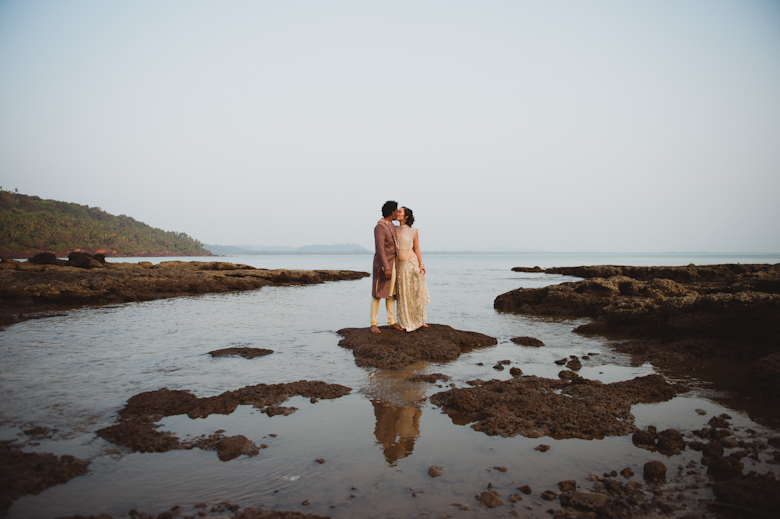 Goa wedding - bride and groom kiss on the beach