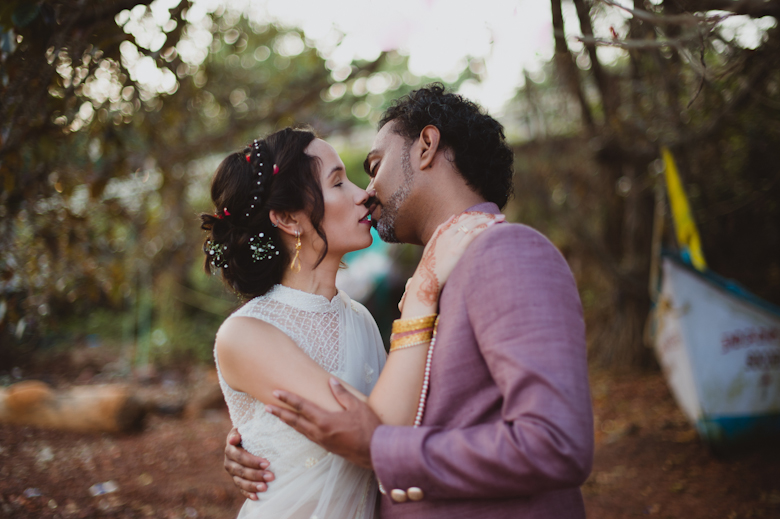 bride and groom kiss, Goa Wedding by Sasha Weddings - photographer for destination wedding