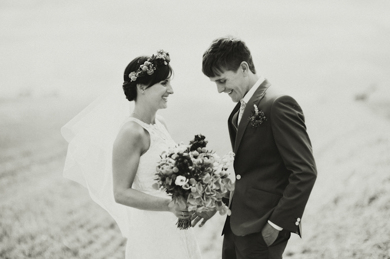 Oxfordshire wedding photographer UK - Bride and groom on a field