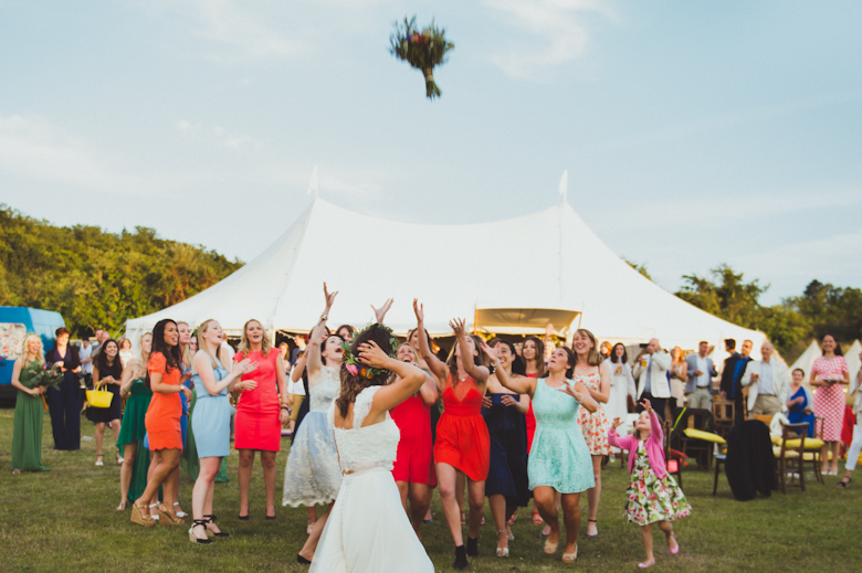 Wedding Photographer Sussex - bride throwing a bouquet