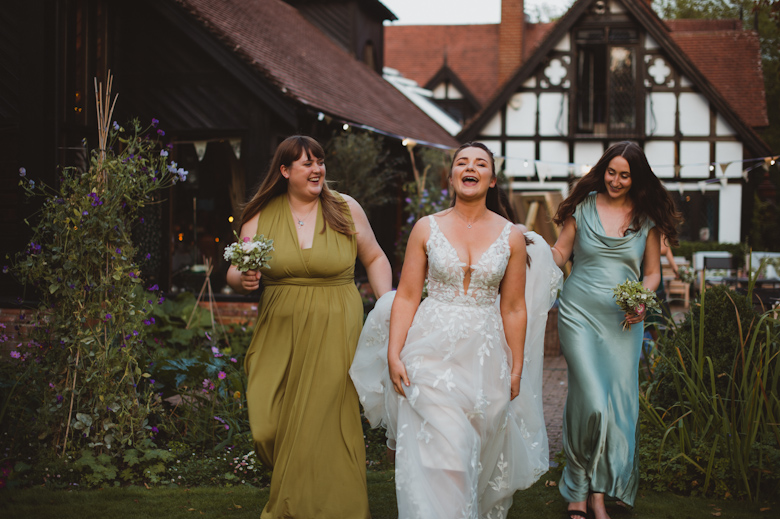 Intimate Outdoor Wedding by the river - Bride and bridesmaids laughing