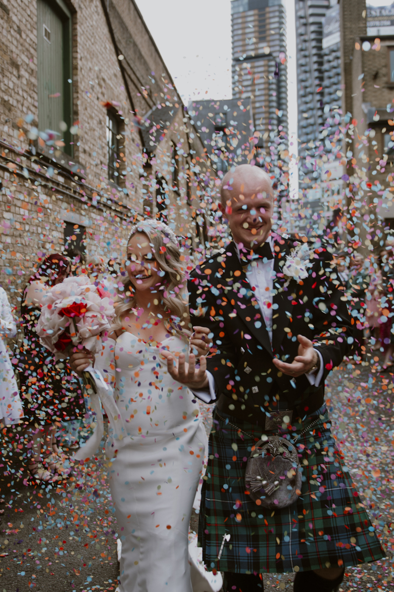 East London Shoreditch Wedding Photography - Shoreditch Studios Wedding Photographer lots of colourful confetti