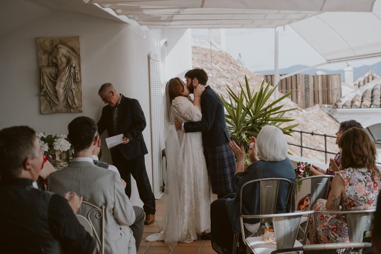 Spain Destination wedding Photographer - Mountain village wedding in Spain - candid photography - the kiss